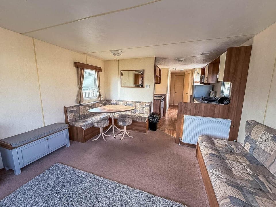 Cozy living and dining area with ample natural light