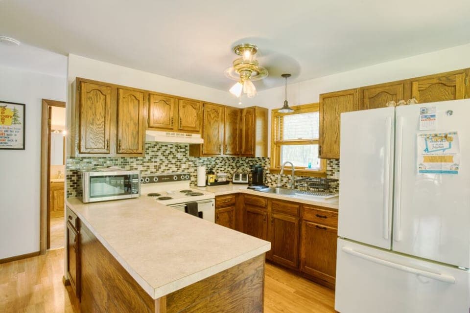 Microwave, electric stove, keurig, basic cooking essentials. K cups included. 