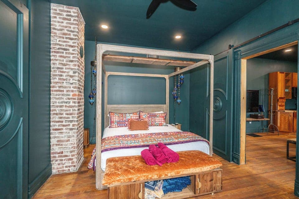 Eclectic king suite with ensuite bath & oversized screen for cozy movie nights​