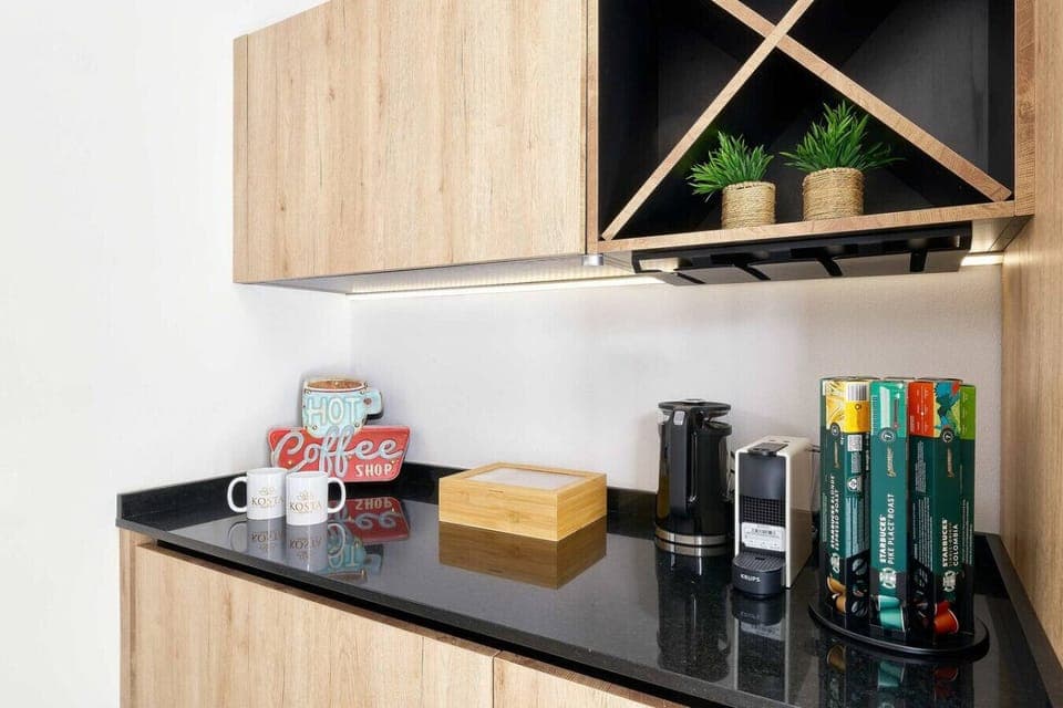 Coffee station with kettle, Nespresso machine, Nespresso capsules, and several tea options for you to enjoy during your stay.