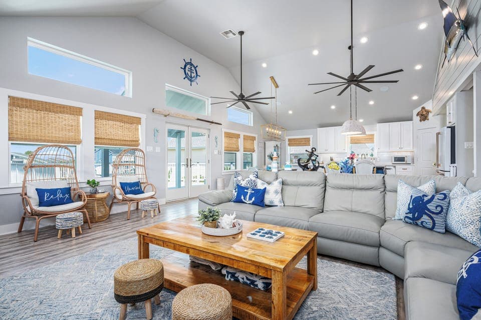 Open living room with coastal décor and natural light.