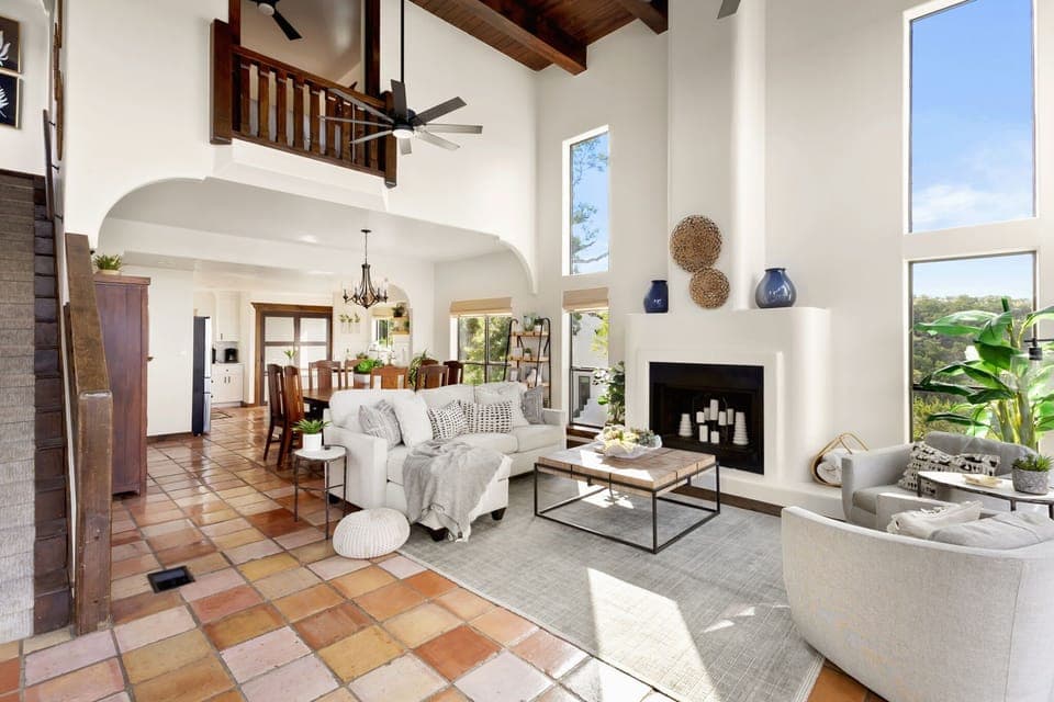 Bright, airy living space with soaring ceilings and cozy charm.