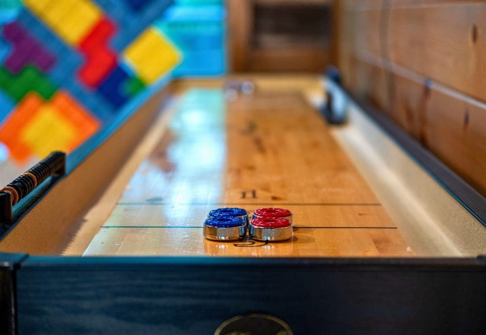 Enjoy a friendly game of shuffleboard in the game loft, the perfect place to unwind and share laughs after a day of outdoor adventure.