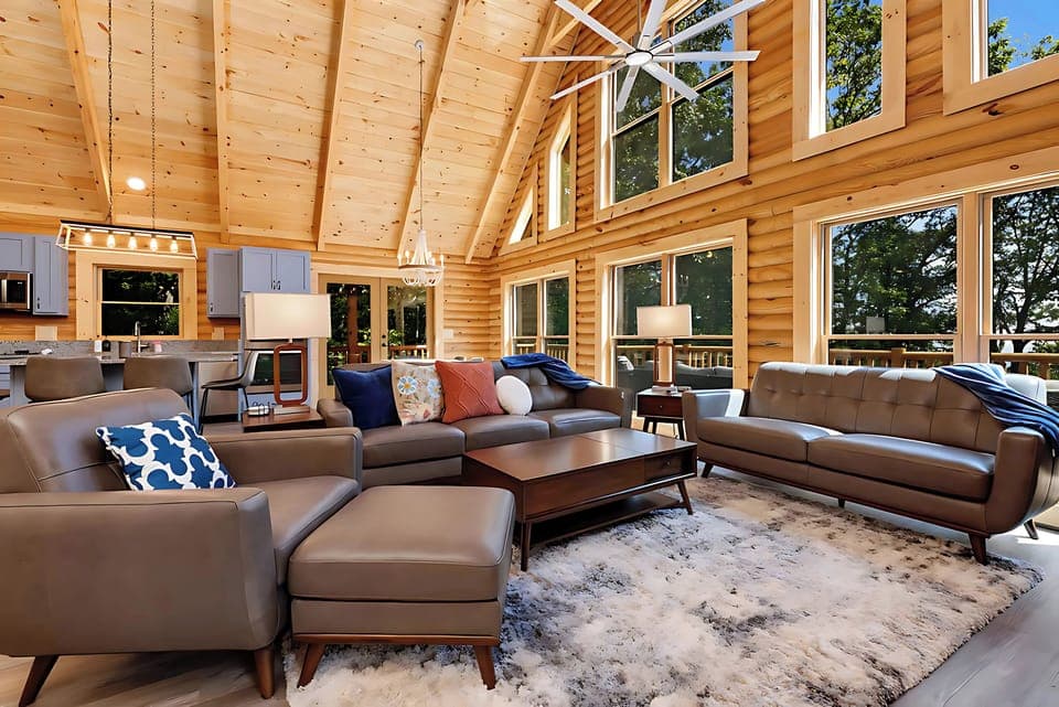 Living room with vaulted ceiling, open to kitchen and dining
