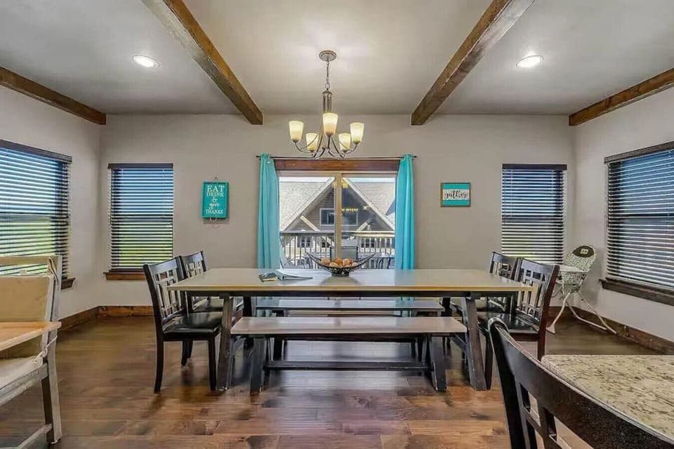Spacious, fully stocked kitchen with two oversized dining tables and room for 20 guests to gather and share meals.