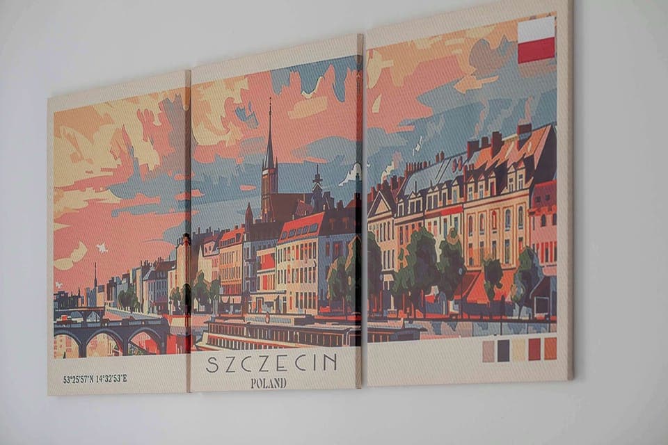 Close-up of colorful framed cityscape artwork hanging on the wall.