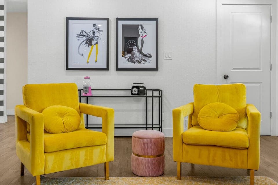 A cozy living room with large smart TV- the fireplace is not operational