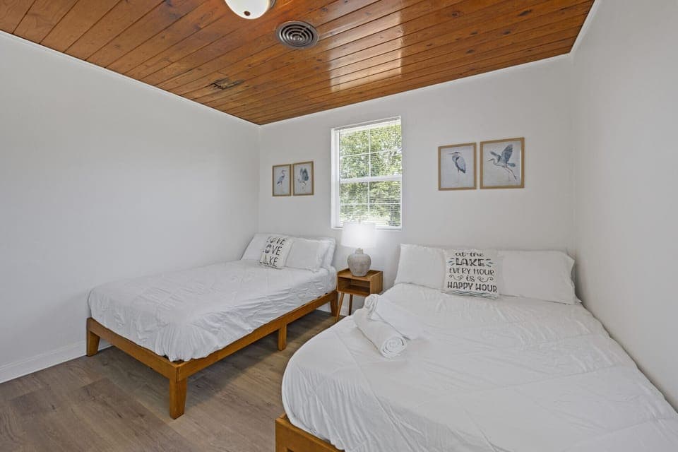 Charming twin beds, cozy vibes, and natural light.