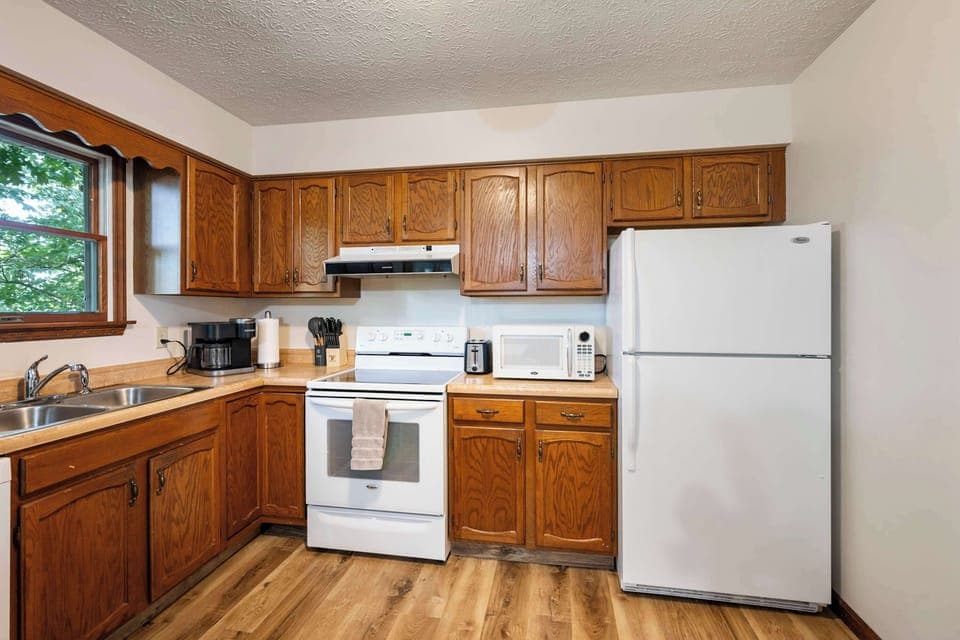 The inviting kitchen offers ample space & all the comforts of home​
