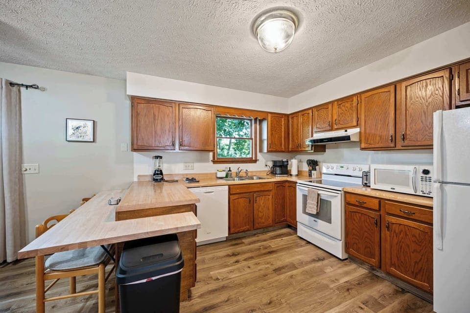 The inviting kitchen offers ample space & all the comforts of home​