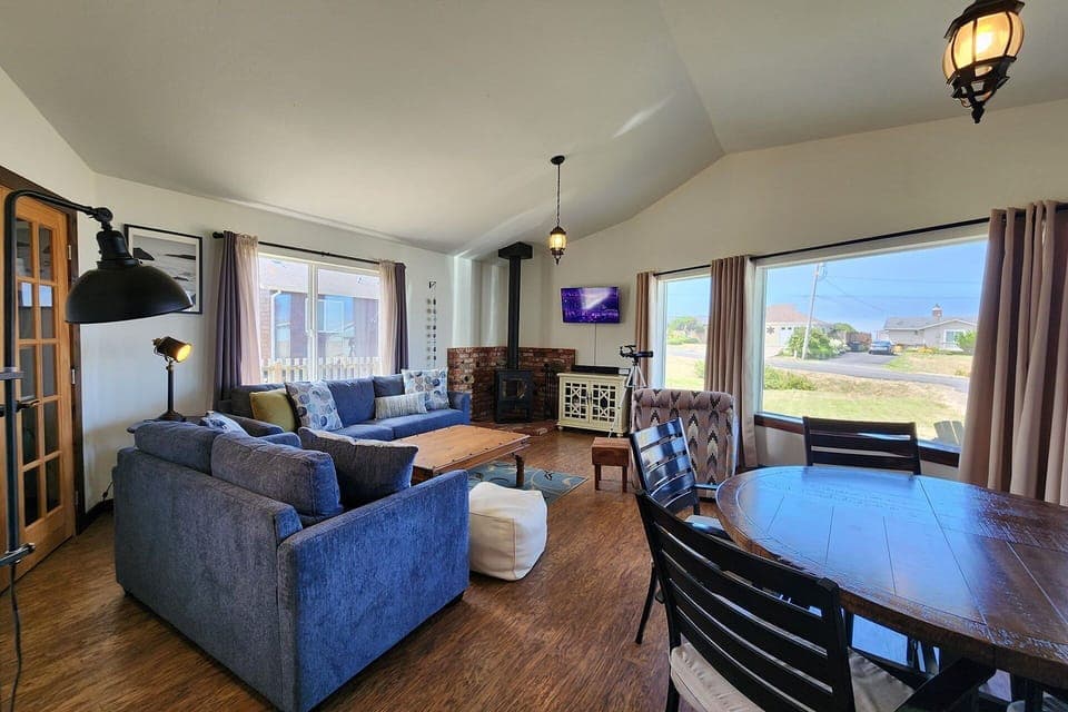 Open concept living area has a view of the ocean.