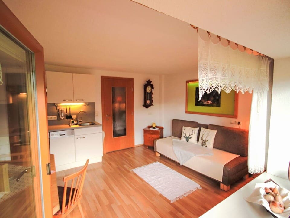 Furniture, Interior Design, Couch, Flooring, Wood, Floor, Room, Living Room, Ceiling, Lighting