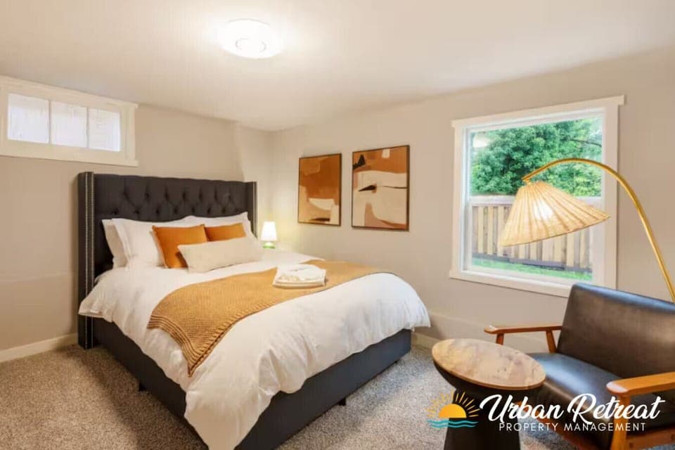 Cozy and stylish bedroom with a plush bed, modern décor, and plenty of natural light, perfect for a restful night’s sleep.