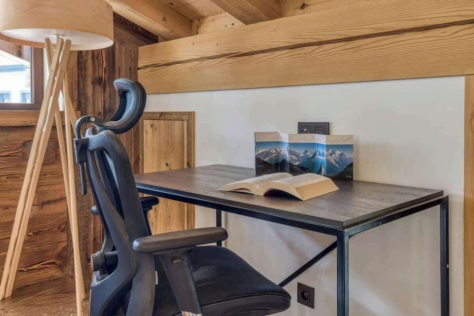Working area that is next to the dining table, just before entering the bedroom under the eaves. There is another working space in the bedroom upstairs.