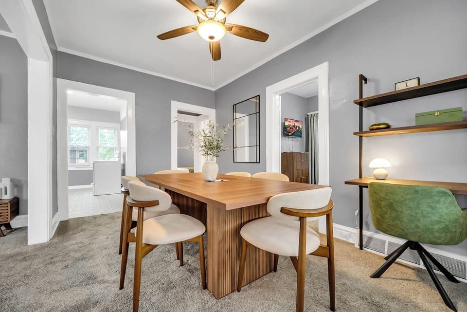 Modern dining for six plus a dedicated remote-work desk. 