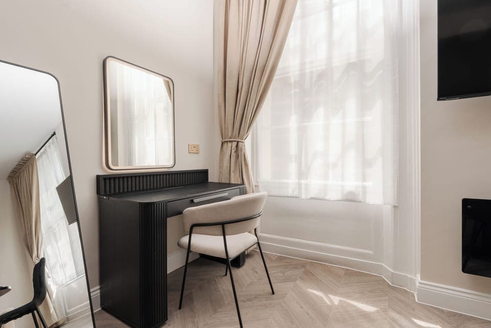 Dedicated vanity space with mirror, ideal for makeup or light work