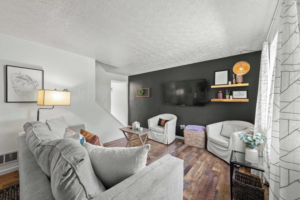 Curl up in the chic living room & stream your favorites on the smart TV​