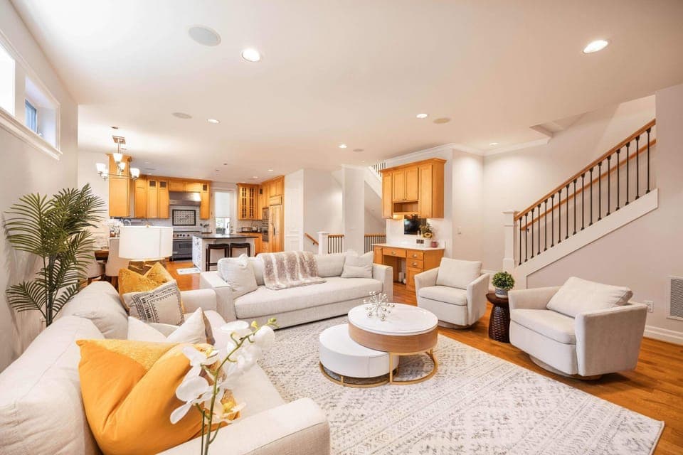 Bright, airy living area with a mix of textures and warm lighting.