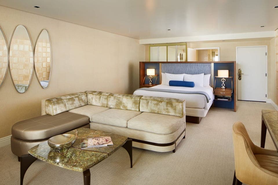 Unwind on the plush sofa after sinking into crisp bedding.