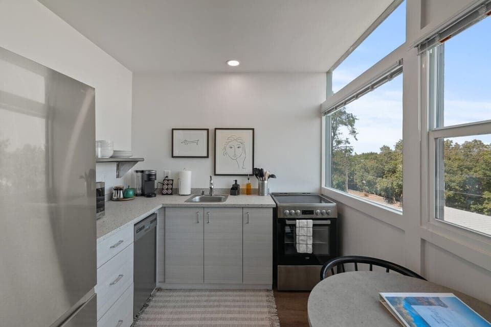 Fully stocked kitchen with modern appliances, cookware, and local flair.