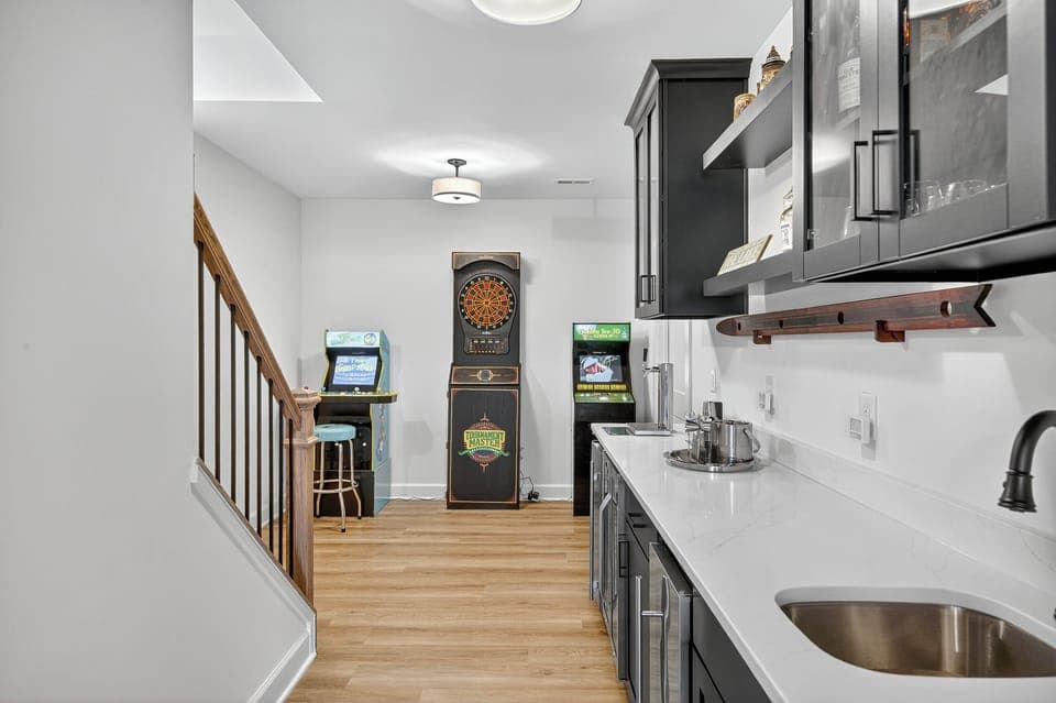 Arcade games, bar, game nook, and additional lounge space make this the perfect rainy-day retreat.