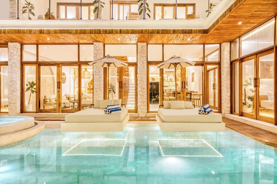 Lounge by the water in a sun-drenched sanctuary of calm and style