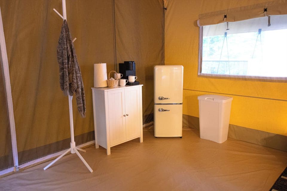 Kitchenette area with mini fridge and coffee station