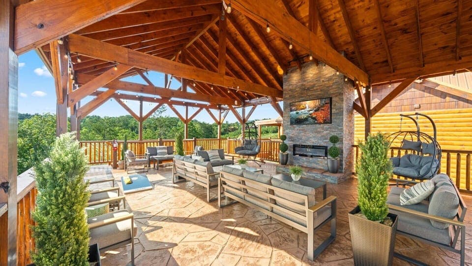 Enjoy a true Smoky Mountain getaway with this sprawling deck that boasts a stunning birds-eye view!