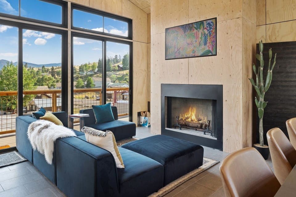 Light-filled living room with a cozy fireplace