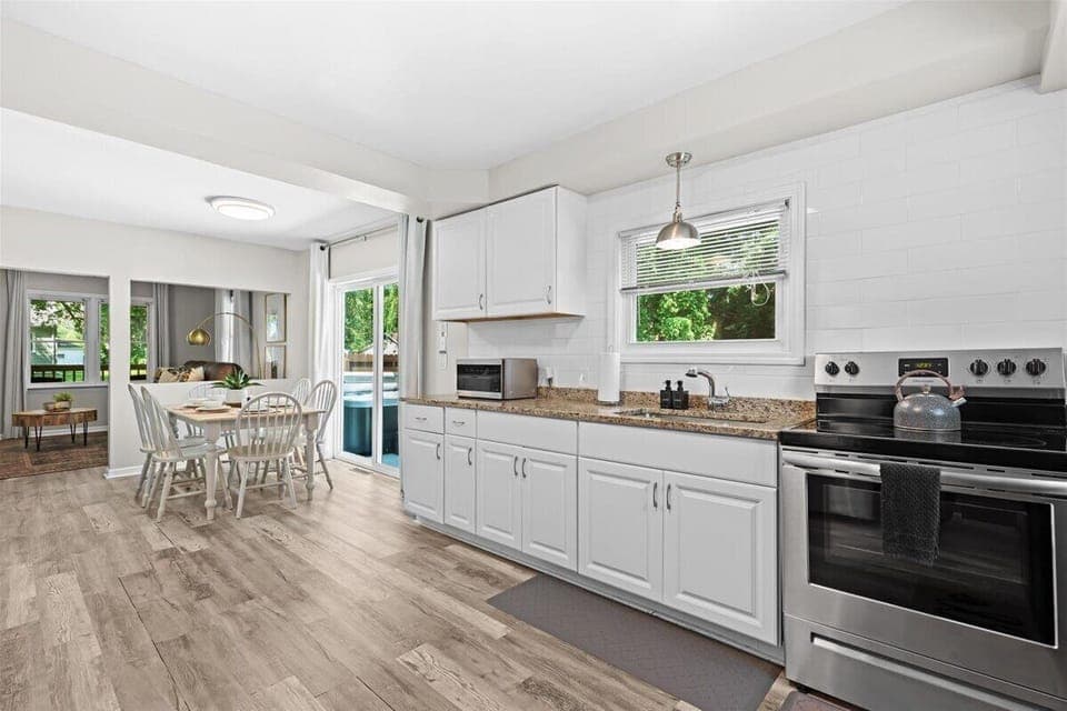 Open kitchen and dining area designed for gathering and entertaining