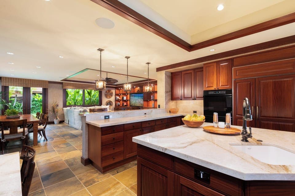 Gourmet kitchen with quartzite counters, premium appliances, and walk-in pantry.