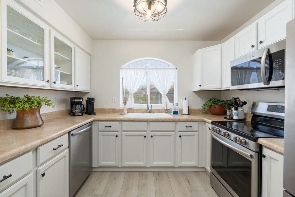 The well-stocked kitchen boasts new appliances and all the essentials to prepare anything from a quick snack to a full dinner.