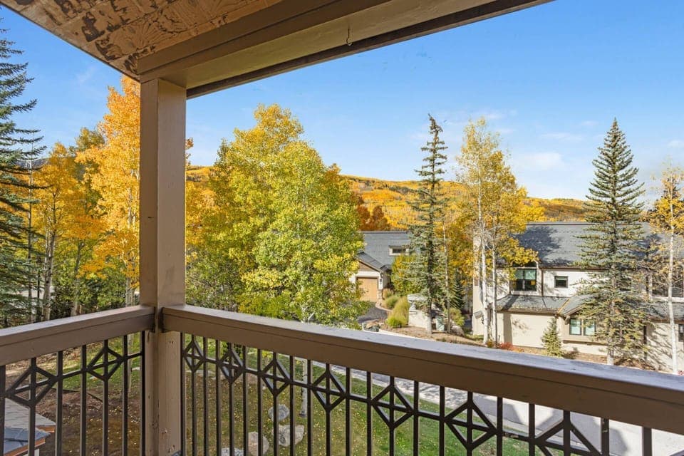 Townhome features a private balcony with gas grill and mountain views.
