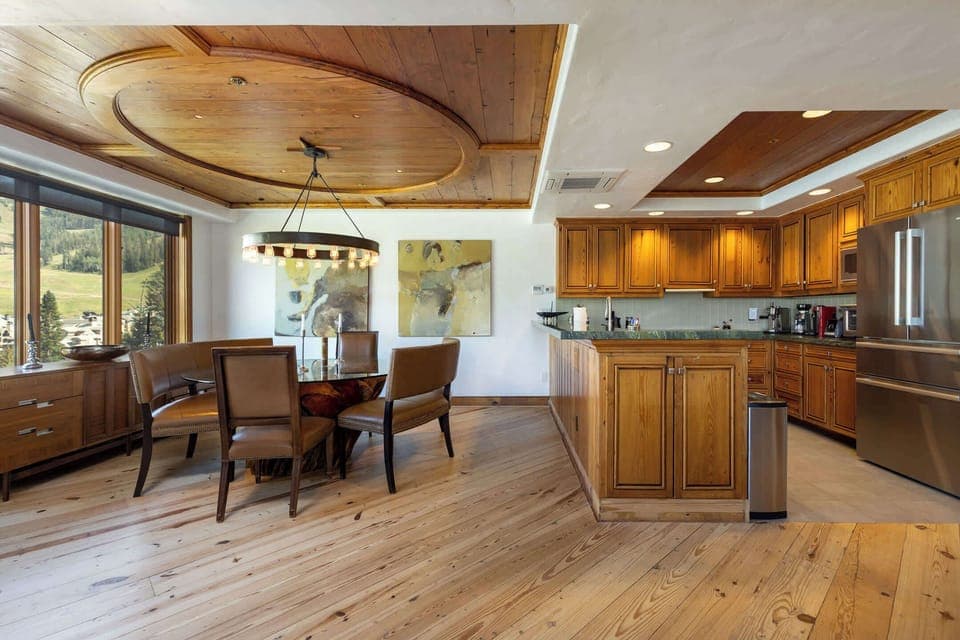 Large dining table with views of Beaver Creek. Comfortably seats six. Galley kitchen with high end appliances