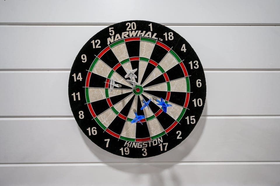 Bullseye-ready dartboard with sleek panels for game night & precision play.