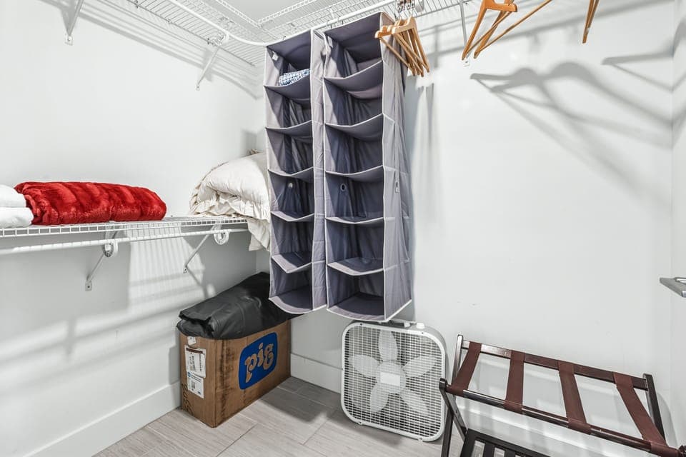 Your walk-in closet offers generous hanging space, wire shelving, and fabric organizers to keep your belongings perfectly arranged during your stay.