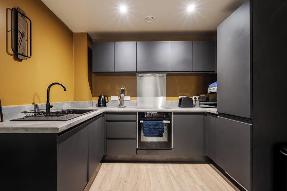 Cook, dine, and unwind – fully equipped kitchen with oven, microwave, and even a dual Air-Fryer.