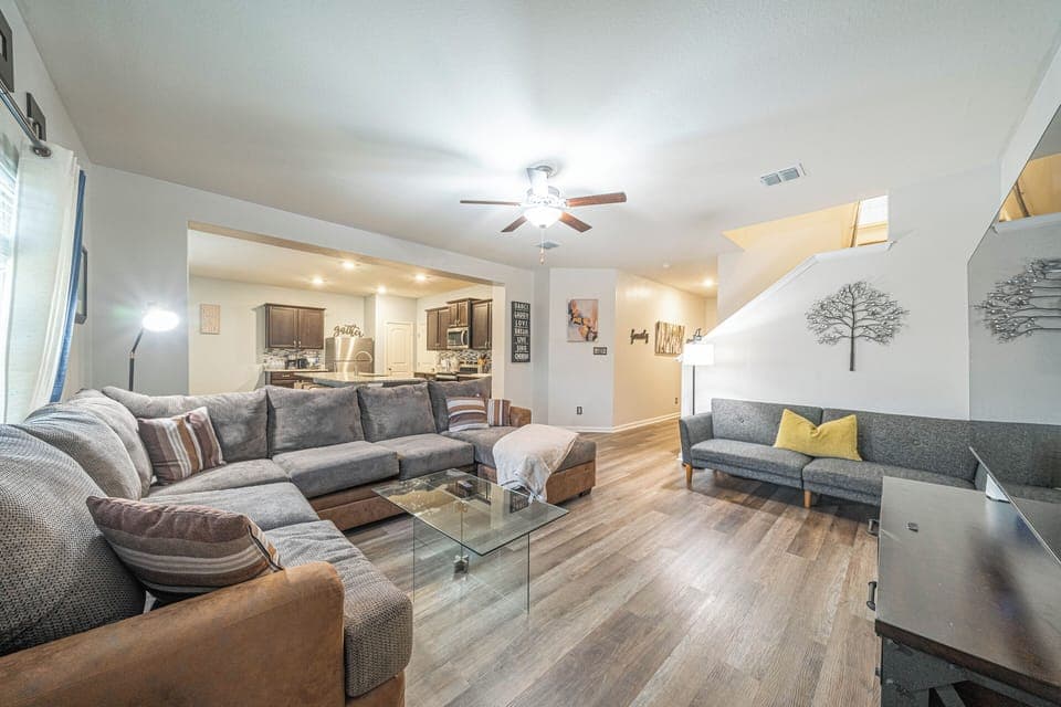 Spacious lounge area with stylish furniture and entertainment options.