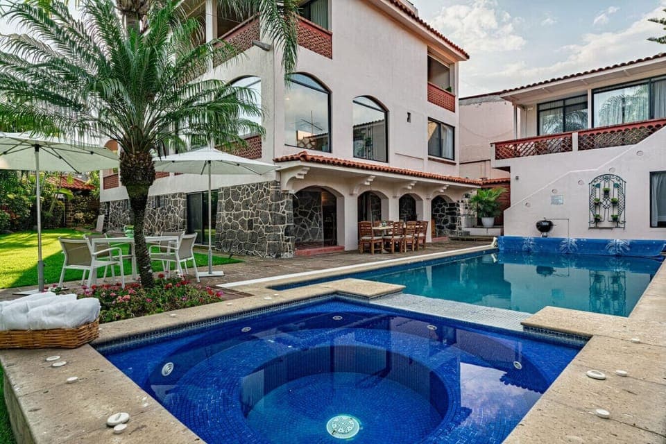 Relax by the sparkling pool and soothing jacuzzi at your colonial retreat.