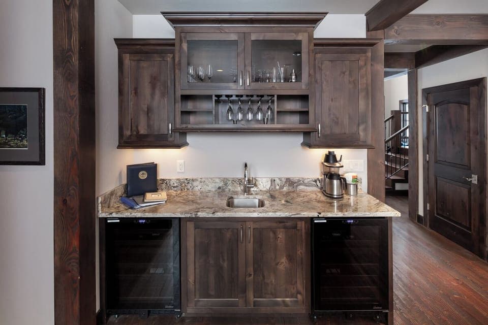 Sip evening wine at the built-in bar with glass storage.