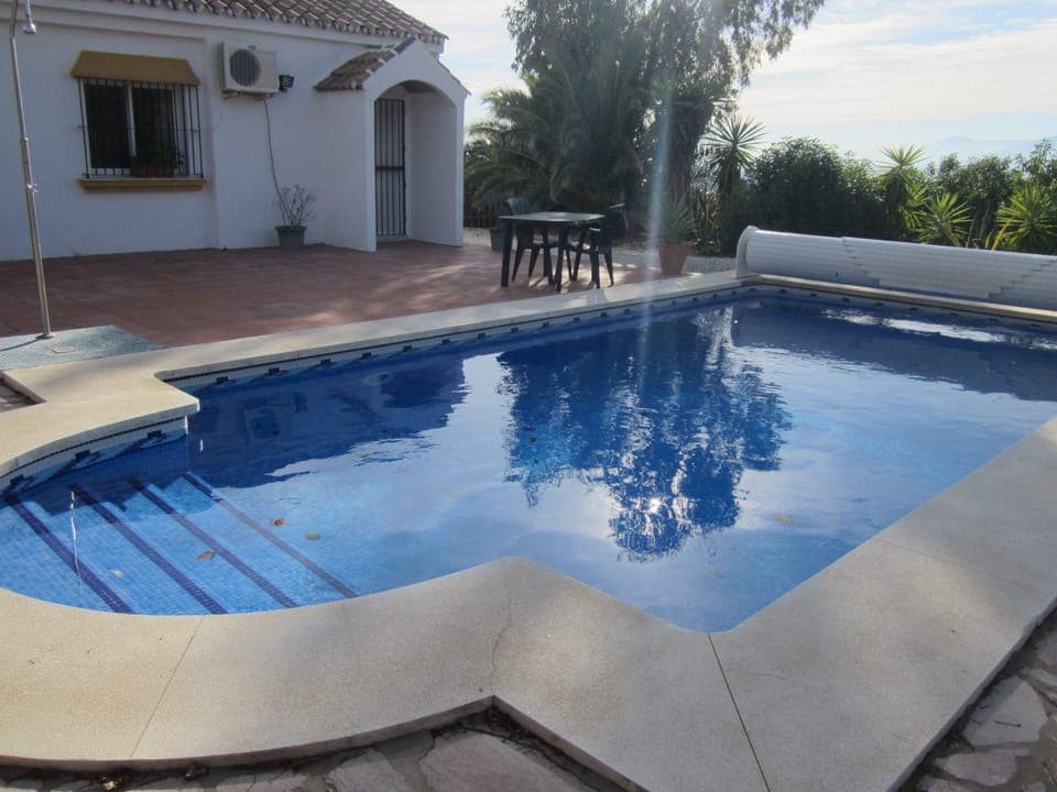 A view accross the pool. The window of bedroom 2 overlooks the terrace and pool
