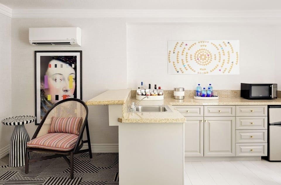 Refresh with a bright kitchenette setup for snacks and sips.