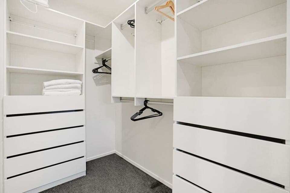 There is plenty of storage in the walk-in wardrobe for all your personal belongings.