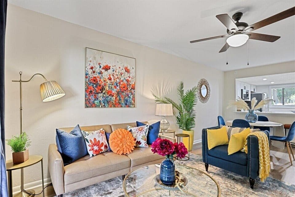Bright pops of color and cozy textures make this living space feel warm, cheerful, and inviting.