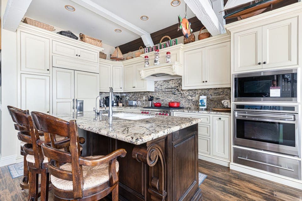 Pull up a seat at the generous kitchen island with barstool seating for three
                