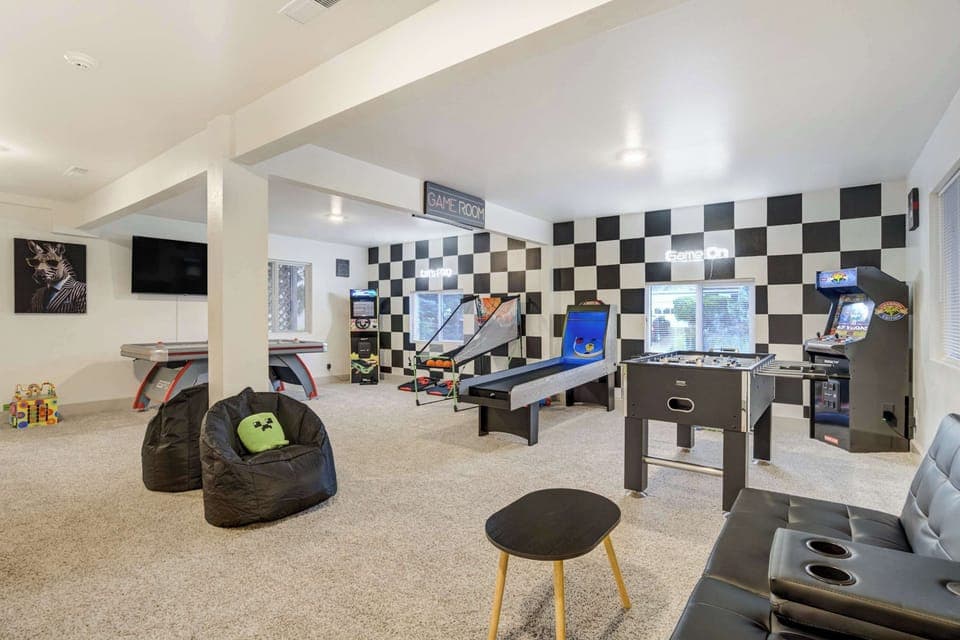 Welcome to Champion Estate!The game room is set up for fun with a skee-ball machine, foosball table, and classic arcade games, making it a favorite hangout for both kids and adults.
