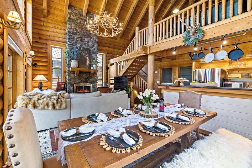 Elegant cabin dining with rustic charm and the warmth of a glowing fire