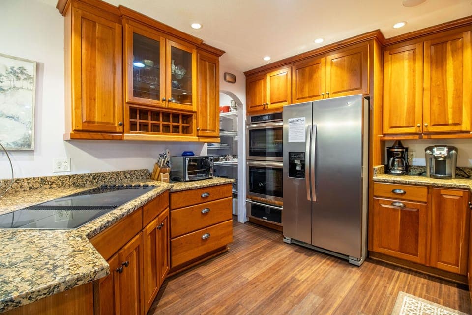 Full kitchen includes cooktop, double ovens, dishwasher, refrigerator, microwave, and more!