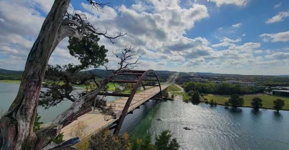 The Pennybacker Bridge, often referred to as the "360 Bridge," stands as an elegant symbol of modern engineering, its graceful, sweeping arches cutting through the Texas skyline. It is 20mins drive.