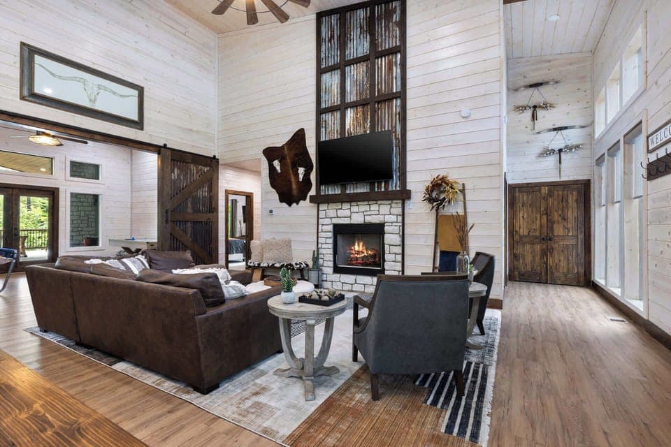 Kick back and relax in our stylish haven! With a cozy fireplace, comfy seating, and a touch of rustic charm, our living space is perfect for unwinding after a day of adventure (or just a day of lounging). Who's ready to put their feet up?